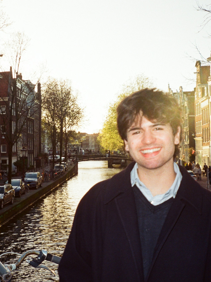 jack in copenhagen with river and buildings behind